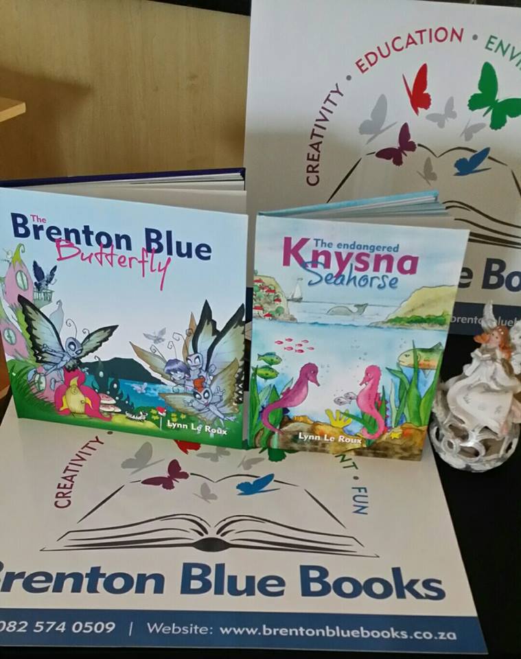 The Brenton Blue Books collection — illustrated children's books about South Africa's endangered creatures, displayed with the Brenton Blue Books banner